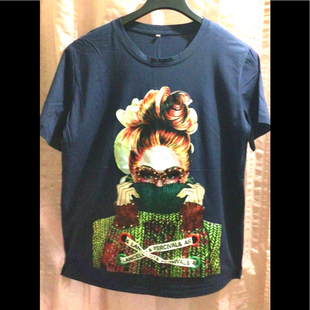 Woman with the Mask T-Shirt. Definitely a conversation piece. Beautiful material